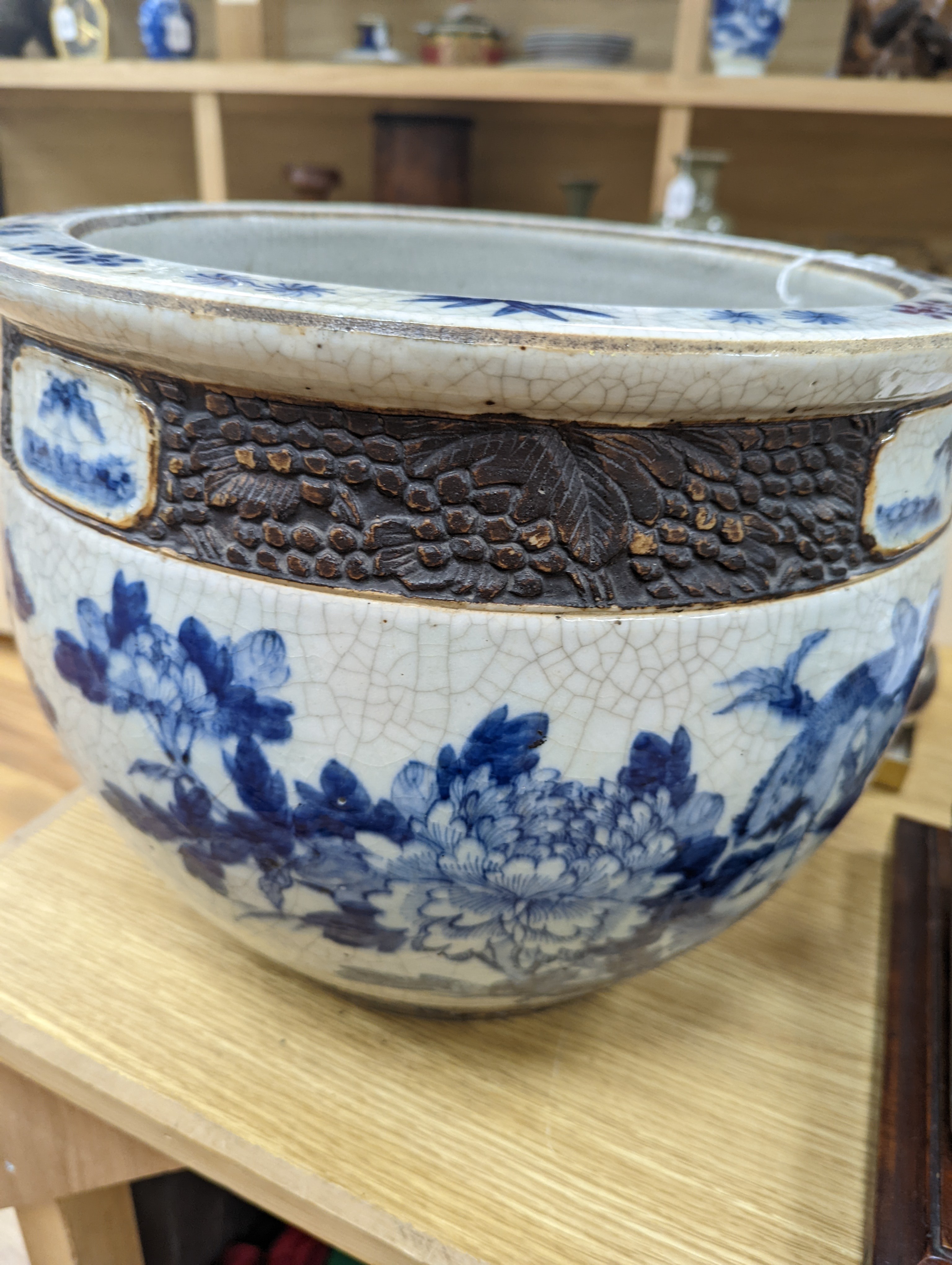 A late 19th/early 20th century Chinese blue and white crackleglaze jardiniere 30cm